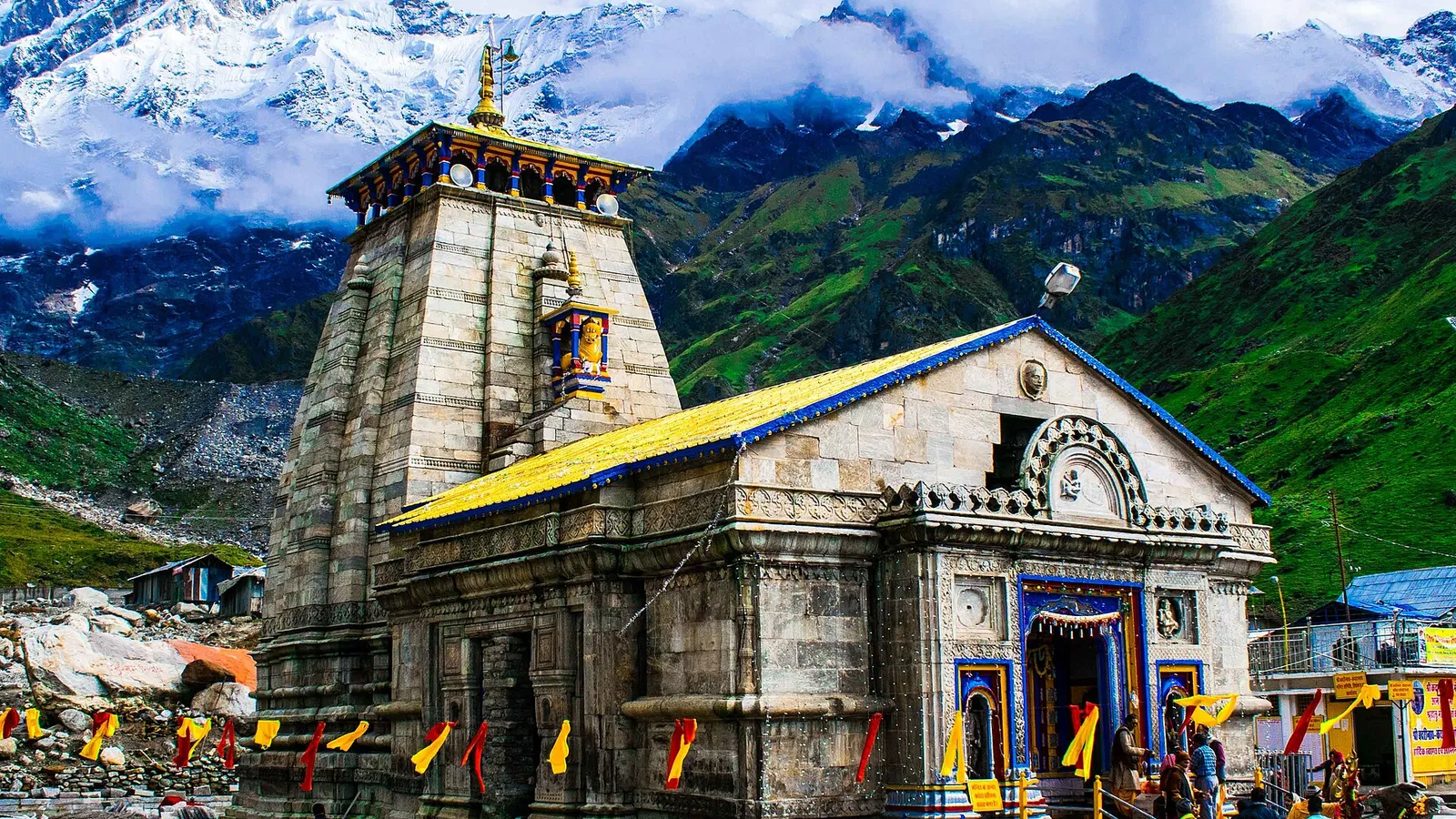 Kedarnath Jyotirlinga temple against the snow-capped Garhwal Himalayas during the monsoon