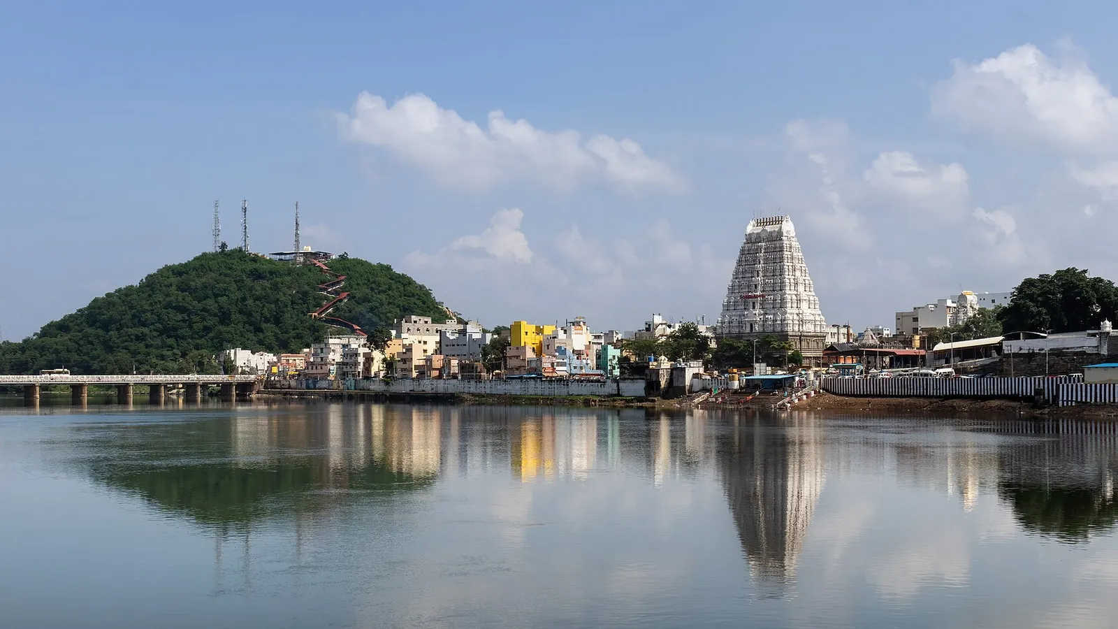 Sri Kalahasti Temple gopuram and hill reflected in the Swarnamukhi river